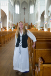 Canada 425 Young woman drssed in Acadian custume in a church in Metaghan, Acadian region of Nova Scotia, Canada - photo by D.Smith