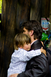 Zipaquir, department of Cundinamarca, Colombia: a toddler in his father's arms as they enter Zipaquir Salt Cathedral - photo by E.Estrada