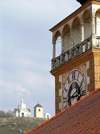 Czech Republic - Mikulov / Nikolsburg (Southern Moravia - Breclav district): clock of St Wenceslas Church - Holy Hill in the background  - photo by J.Kaman
