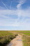 Hope Valley, Peak District, Derbyshire, England: sky with aircraft contrails and hiking trail - near Castleton - photo by I.Middleton