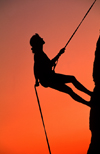 Gorges du Verdon, Alpes-de-Haute-Provence, PACA, France: silhouette o climber rapelling on rocks at sunset - mountaineering - photo by S.Egeberg