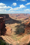 Canyonlands National Park, Utah, USA: Shafer Canyon with mesas in background - seen from Shafer Trail Road, Island in the Sky district - cumulus clouds - switchbacks - photo by M.Torres