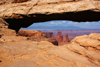 Canyonlands National Park, Utah, USA: looking trough Mesa Arch - the arch is perched on a cliff edge - Island in the Sky district - photo by A.Ferrari