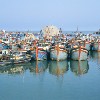 vietnam - The fishing fleet takes a rest (photo by Joe Filshie)